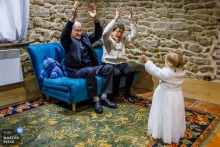 Also at La Closeraie in Volesvres, Bourgogne, France, the grandparents stand with their little girl, and the image folds generations together with tenderness and quiet warmth.
