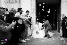 As the bride leaves Eglise de Bonneville, France and falls, her husband rushes to help, turning a stumble into a brief, revealing study of care, panic, and devotion.