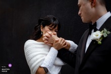 In downtown Montreal, Quebec, the newlywed bride kisses the back of her husband’s hand, and his visible delight makes the gesture feel both old fashioned and deeply alive.