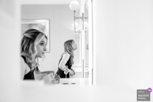 At The English Manor in Ocean Township, New Jersey, bridesmaids gather in the mirror's reflection, their shared getting ready carrying nerves, laughter, and the small rituals of anticipation.