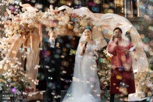 Sinan Mansions in Shanghai, China frames a guest speech beside the smiling couple, with sprayed bubbles turning the moment into something both elegant and lightly festive.