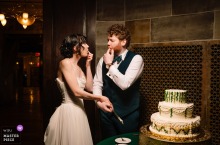 At The Society Room In Hartford, Connecticut, The Couple Tastes Cake Amid Laughter At The Society Room in Hartford, Connecticut, the couple tastes their cake, pausing between elegance and curiosity as frosting, laughter, and anticipation meet on one plate.