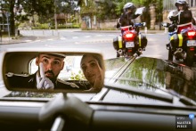 On the road between Bergerac City Hall and Domaine de la Fauconnie in Dordogne, France, national police seem to stop the couple, and the joke lands with perfect absurdity.