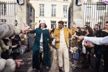 At Mairie de Sèvres in Île-de-France, France, the newlyweds leave city hall beneath a shower of flower petals, a bright civic exit softened by ritual and joy.
