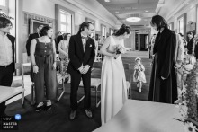 While a little girl cries at the ceremony location in Vannes, Morbihan, Brittany, France, the guests smile with a tenderness that turns awkwardness into a shared, human grace.