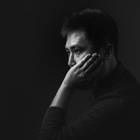 Black and white studio portrait of He Ying Ji, Zhanjiang-based WPJA wedding photographer from Guangdong, China.