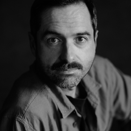 BW studio portrait of Pedro Vilela of Portugal, a Lisbon wedding and elopement photographer