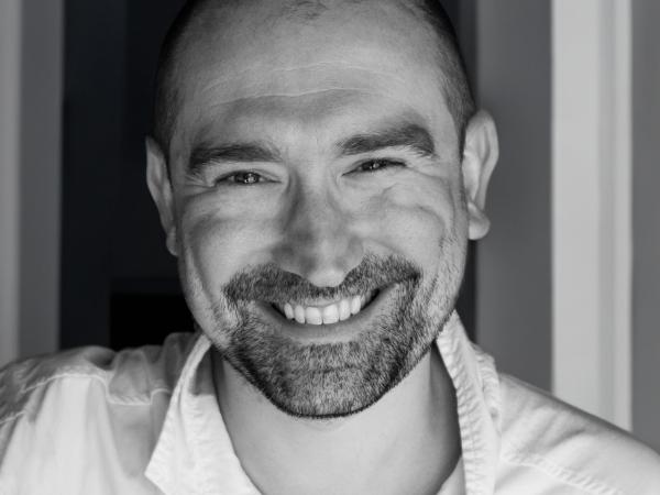 BW Portrait of London Wedding Photographer Chris Boland A black and white portrait of Chris Boland, a wedding photographer from London, England, and a member of the Wedding Photojournalist Association (WPJA).