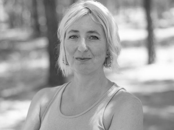 Black and white lifestyle portrait of wedding photographer Ruth Blamire-Brown