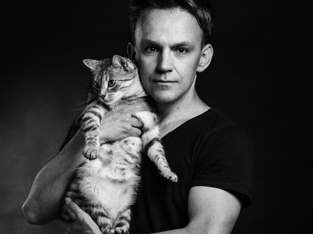  Black and white portrait of Europe-based wedding reportage photographer Bartosz Jastal.