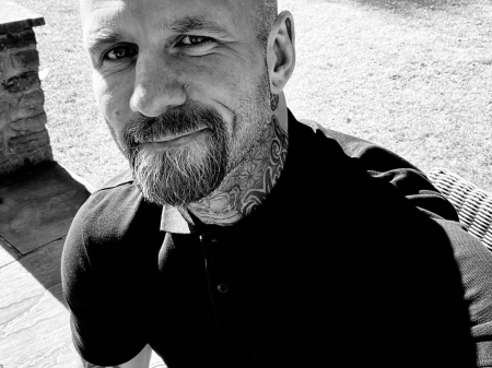 Lifestyle portrait of Daniel Kingscott, a documentary wedding photographer based in Pencoed, South Wales, known for capturing authentic and natural wedding moments.