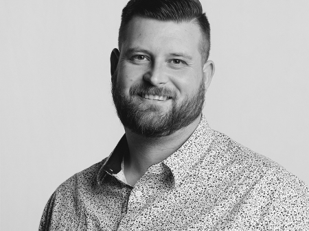 BW studio portrait of Rainer Macalister, a wedding and elopement photographer Wedding and elopement photography by Rainer Macalister of New Zealand