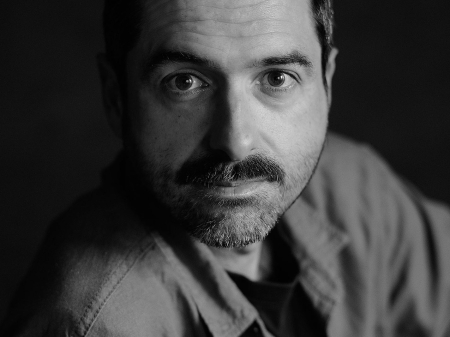 BW studio portrait of Pedro Vilela of Portugal, a Lisbon wedding and elopement photographer