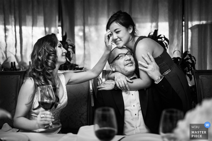 Ukraine guest hugs groom at the reception | Europe wedding reportage photography 