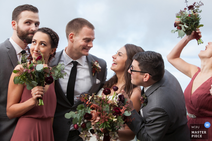 Photo by: <a href="https://www.wpja.com/contests/2017-tri1-photography-competition/wildcard-portrait/2007561">Joyce Perlman - United States</a> San Francisco wedding photographer created this humorous portrait of the bridal party being silly and having fun.