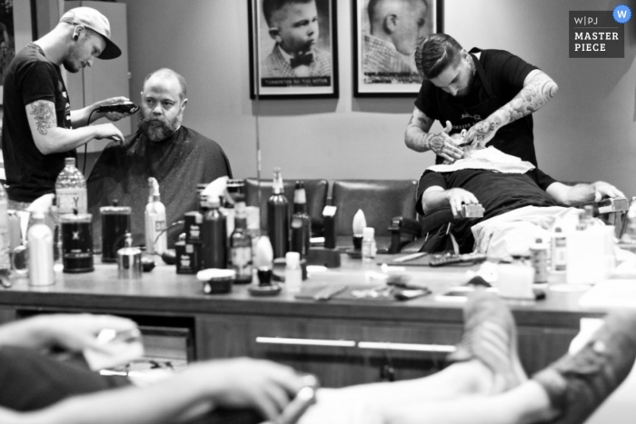 Photo by: <a href="https://www.wpja.com/contests/2013-q1-contest/full-frame-black-and-white/1137151">Jo Cush - Australia</a> Melbourne wedding photographer captured this black and white photo of the groomsmen getting ready at the barber shop before the ceremony