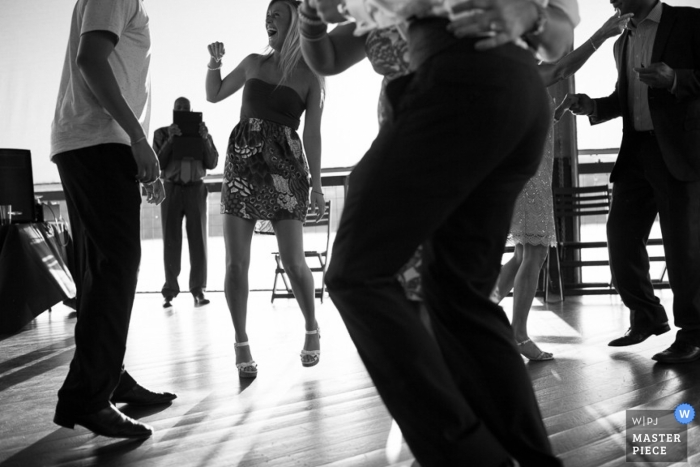 Photo by: <a href="https://www.wpja.com/contests/2013-q1-contest/full-frame-black-and-white/1152096">Brett Buchanan - United States</a> Austin wedding photographer captured this black and white photo of guests dancing on the outdoor dance floor