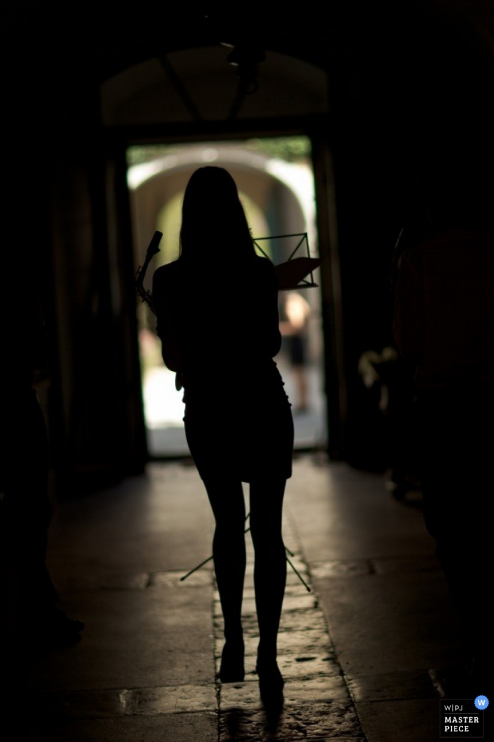 Wedding Photographer in Vienna | Image contains: woman, silhouette, walking, podium, stand