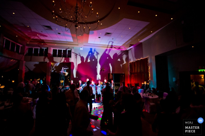 IE Waterford Wedding Reportage Photographer | Image contains: reception, band, live music, dancing, lights