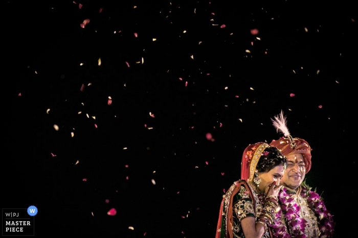 Photo by: <a href="https://www.wpja.com/contests/2014-q1-photography-contest/ceremony/1397491">Christophe Viseux - Canada</a> Wedding Photography in Toronto | Image contains: flower pedals, bride, groom, tradition, color