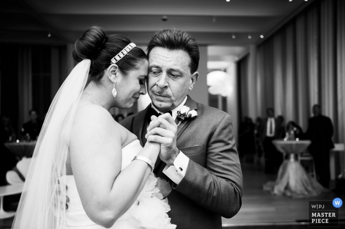 Photo by: <a href="https://www.wpja.com/contests/2014-q3-photography-contest/parents/1499176">Shane Snider - United States</a> Raleigh Documentary Wedding Photographer | Image contains: bride, father of the bride, father and daughter, dance, reception, emotional