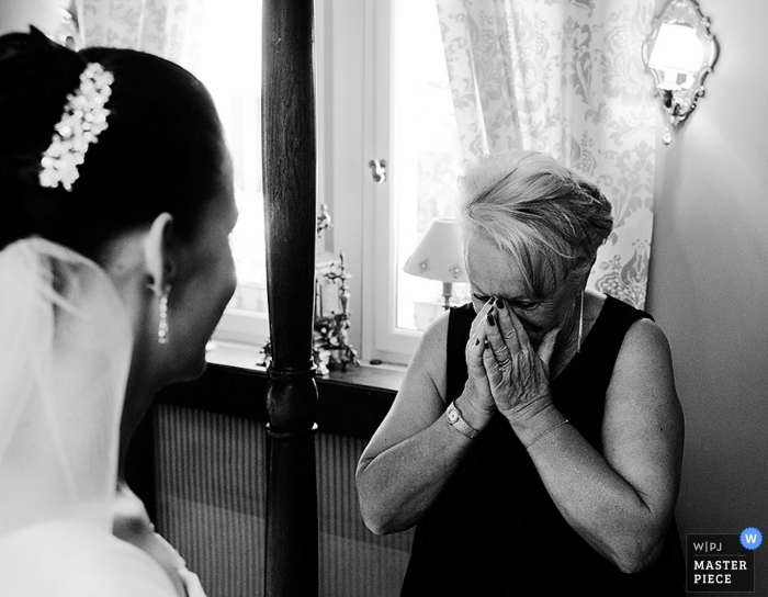 Photo by: <a href="https://www.wpja.com/contests/2014-q3-photography-contest/parents/1504376">Philip Stephenson - France</a> Paris Wedding Photography | Image contains: bride, mother of the bride, tears, emotional, black and white, ceremony