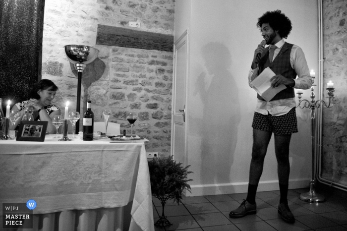 Photo by: <a href="https://www.wpja.com/contests/2014-q4-photography-contest/toastingspeeches/1561926">David Page - France</a> Lot-et-Garonne wedding photogrpaher captured this black and white image of the groom giving his speech in his boxers at the reception