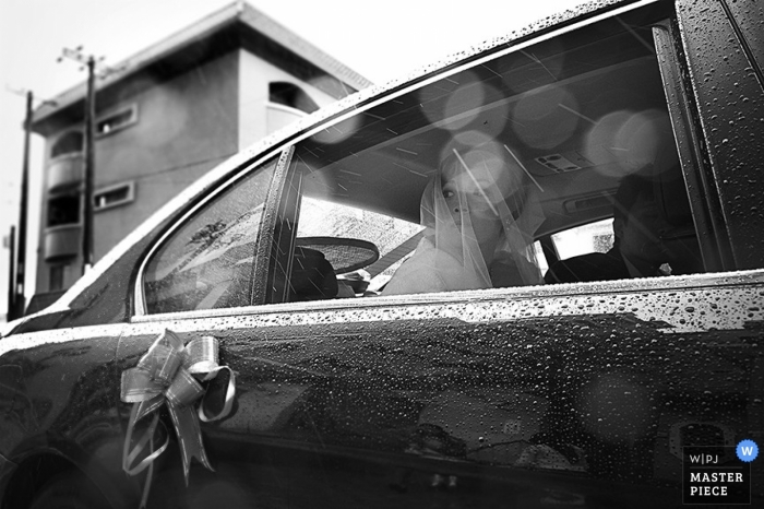 Photo by: <a href="https://www.wpja.com/contests/2014-q4-photography-contest/weather/1564336">I-Hsuan Huang - Taiwan</a> A rainstorm doesn't stop the bride from looking regal in this black and white image created by a Tainan wedding photographer