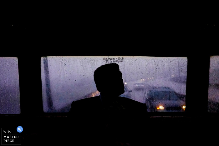 Photo by: <a href="https://www.wpja.com/contests/2015-q3-photography-contest/weather/1701661">Ben Chrisman - United States</a> Charleston groom silhouetted against a window - South Carolina wedding photography
