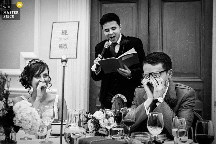 Photo by: <a href="https://www.wpja.com/contests/2015-q4-photography-contest/toastingspeeches/1750401">Lukas Powroziewicz - United Kingdom</a> Scotland wedding reception photo of groom being embarassed by speech