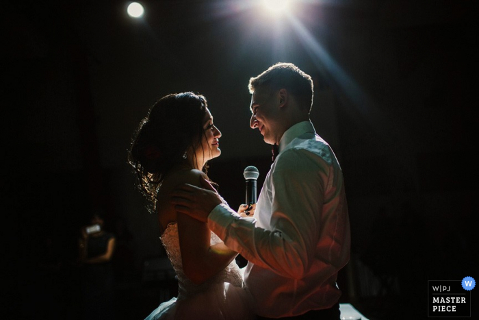 Photo by: <a href="https://www.wpja.com/contests/2015-q4-photography-contest/toastingspeeches/1759486">Artem Pitkevich - Russia</a> Saint-Petersburg wedding reception photos from the floor with a microphone and the bride and groom