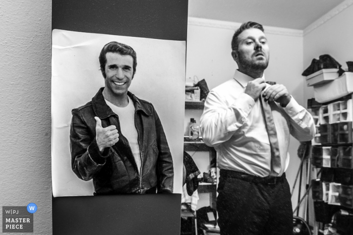 Venice wedding photography of groom getting ready with his tie