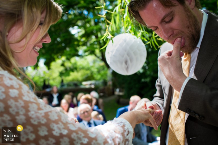 Photo by: <a href="https://www.wpja.com/contests/2015-q4-photography-contest/ring-details/1766556">Jacqueline Dersjant - Netherlands</a> wedding photograph of Noord Holland bride and groom exchanging rings from Amsterdam | wedding ceremony