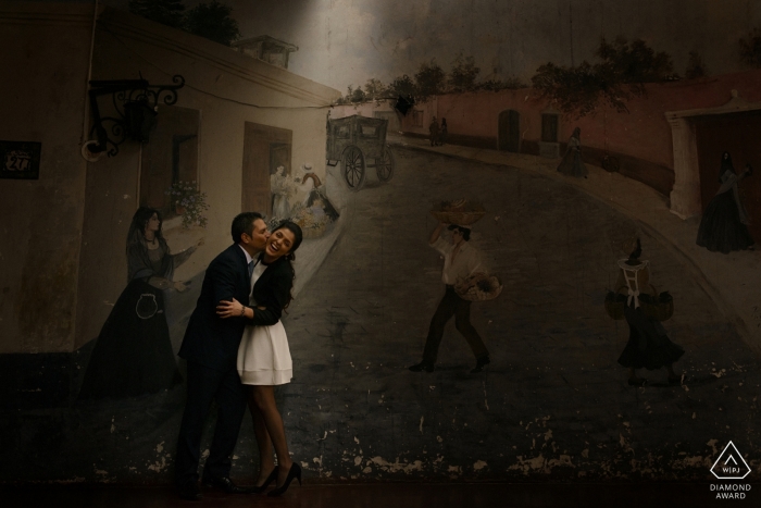 Lima prewedding portrait of a couple with a mural as their backdrop | Peru wedding engagement