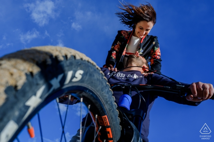 Creative wedding engagement portrait of couple on a mountain bike | Alicante prewedding photography