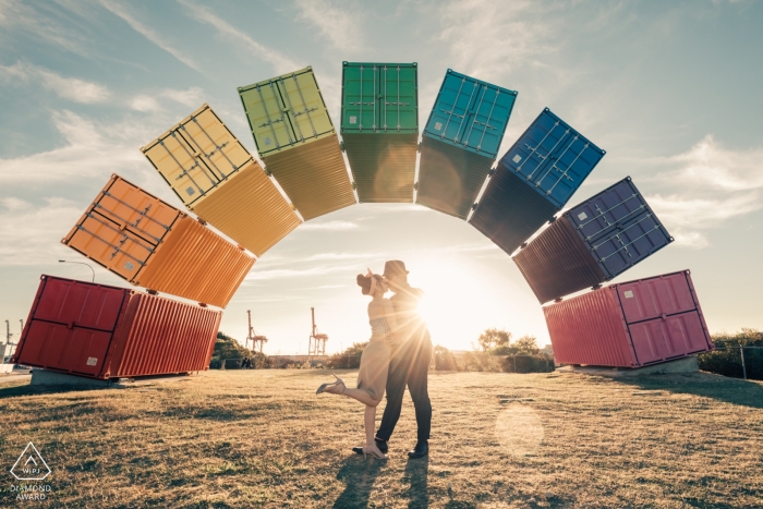Singapore shipping container rainbow arch over engaged couple during a portrait session Singapore shipping container rainbow arch over engaged couple portrait session