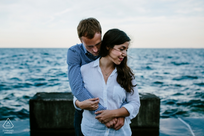 Photo by: <a href="https://www.wpja.com/photos/diamond-award-top-wedding-engagement-photographer/2167656">Sebastian Rotarski - United States Wedding Photographer</a> Denver pictures of a couple near the water by a top Colorado wedding engagement photographer