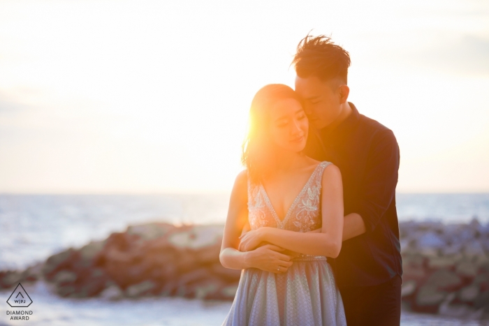 Photo by: <a href="https://www.wpja.com/photos/diamond-award-top-wedding-engagement-photographer/2184456">Chin Whei Tay - Malaysia Wedding Photographer</a> Malaysia couple embraces at the jetty by the ocean for their pre-wedding Photos