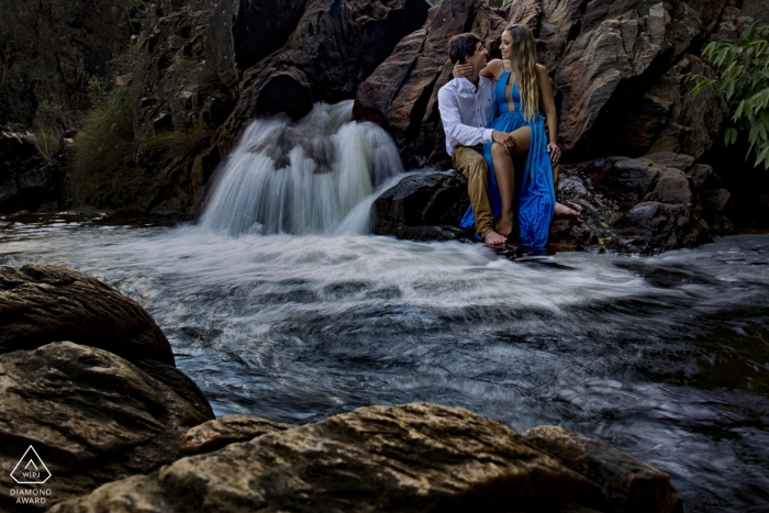 Goias Engagement Photography at a small waterfall with rushing water