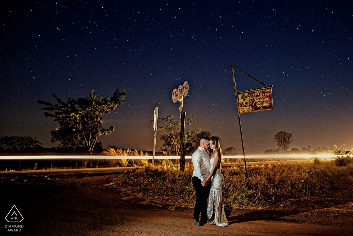 Brazil pre-wedding portraits at night | Long shutter release reveals the headlights of passing cars