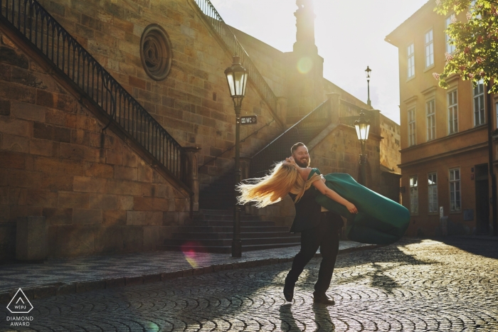 Photo by: <a href="https://www.wpja.com/photos/diamond-award-top-wedding-engagement-photographer/2201561">Kurt Vinion - Czech Republic Wedding Photographer</a> A Czech republic couple spend in the town square as they dance during their pre-wedding portrait session