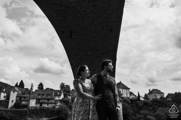 french couple posing for some black and white engagement photography under a bridge french couple | engagement photography under a bridge