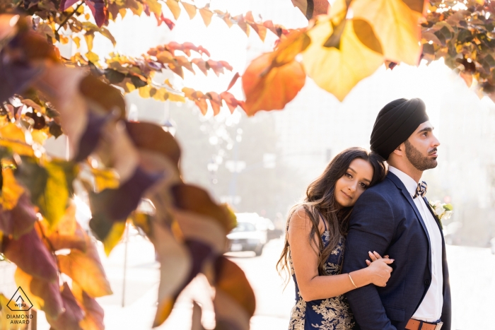California Engagement Photograph of a couple with fall leaves California Engagement Photograph of a couple with fall leaves