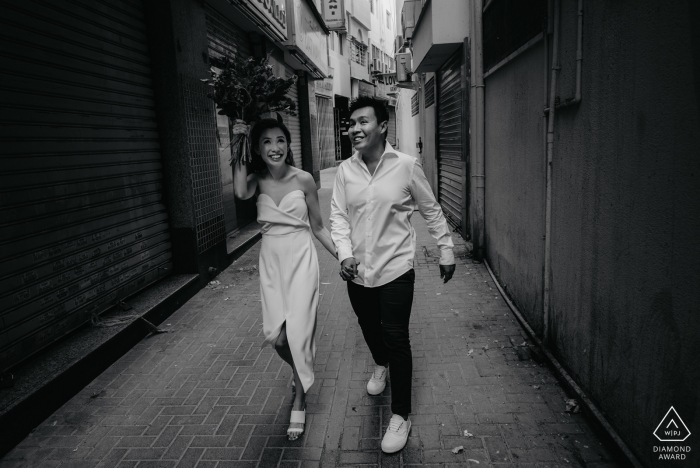 Photo by: <a href="https://www.wpja.com/photos/diamond-award-top-wedding-engagement-photographer/2257501">Bernie Richardson - United Arab Emirates Wedding Photographer</a> Dubai Wedding Photographer shooting in alley with couple walking