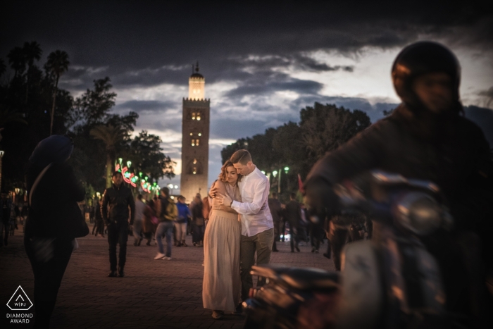 Engagement portrait session on the city streets of Venice with motorcycles and pedestrians