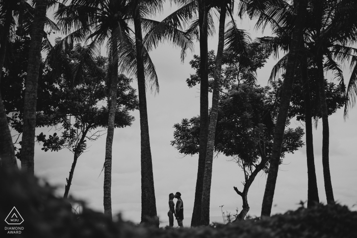 Indonesia tropical photoshoot | pre-wedding engagement pictures of a couple at the beach with palms | Bali portrait shoot