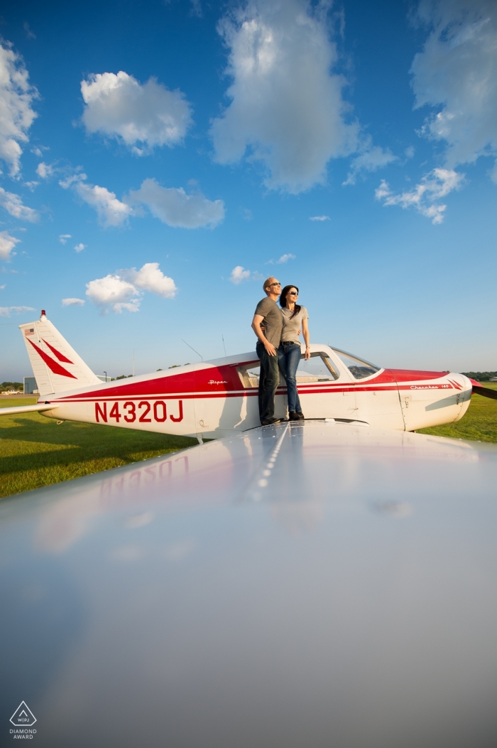 Photo by: <a href="https://www.wpja.com/photos/diamond-award-top-wedding-engagement-photographer/2267866">Joe Szurszewski - Minneapolis Minnesota Looking to the Sky | Minneapolis, Minnesota engagement photography session at the airport with a plane
