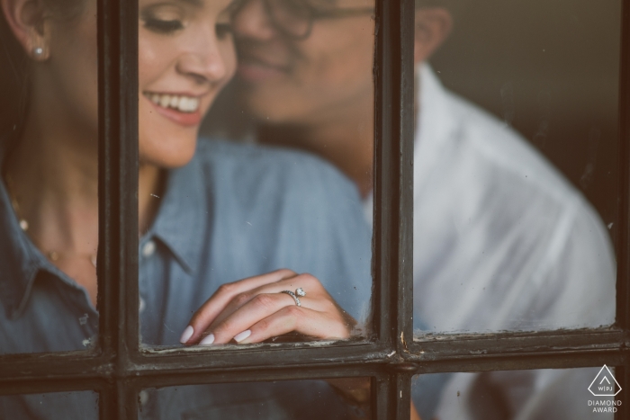 MA pre-wedding engagement pictures of a couple captured through a window MA pre-wedding engagement pictures of a couple captured through a window | Boston portrait shoot