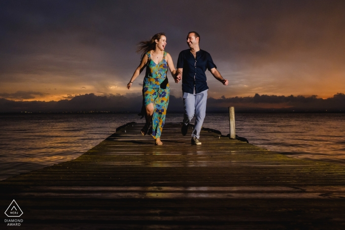 Photo by: <a href="https://www.wpja.com/photos/diamond-award-top-wedding-engagement-photographer/2260796">Toni Miranda - Spain Wedding Photographer</a> engagement shoot with a couple on a dock | Spain photographer pre-wedding session