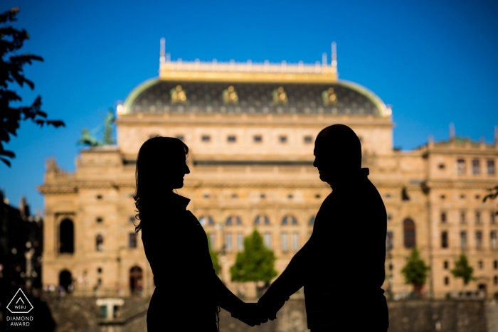 Photo by: <a href="https://www.wpja.com/photos/diamond-award-top-wedding-engagement-photographer/2312691">Matouš Bárta - Prague Prague engagement pictures of a couple silhouetted with buildings in background | Czech Republic photographer pre-wedding photo shoot session